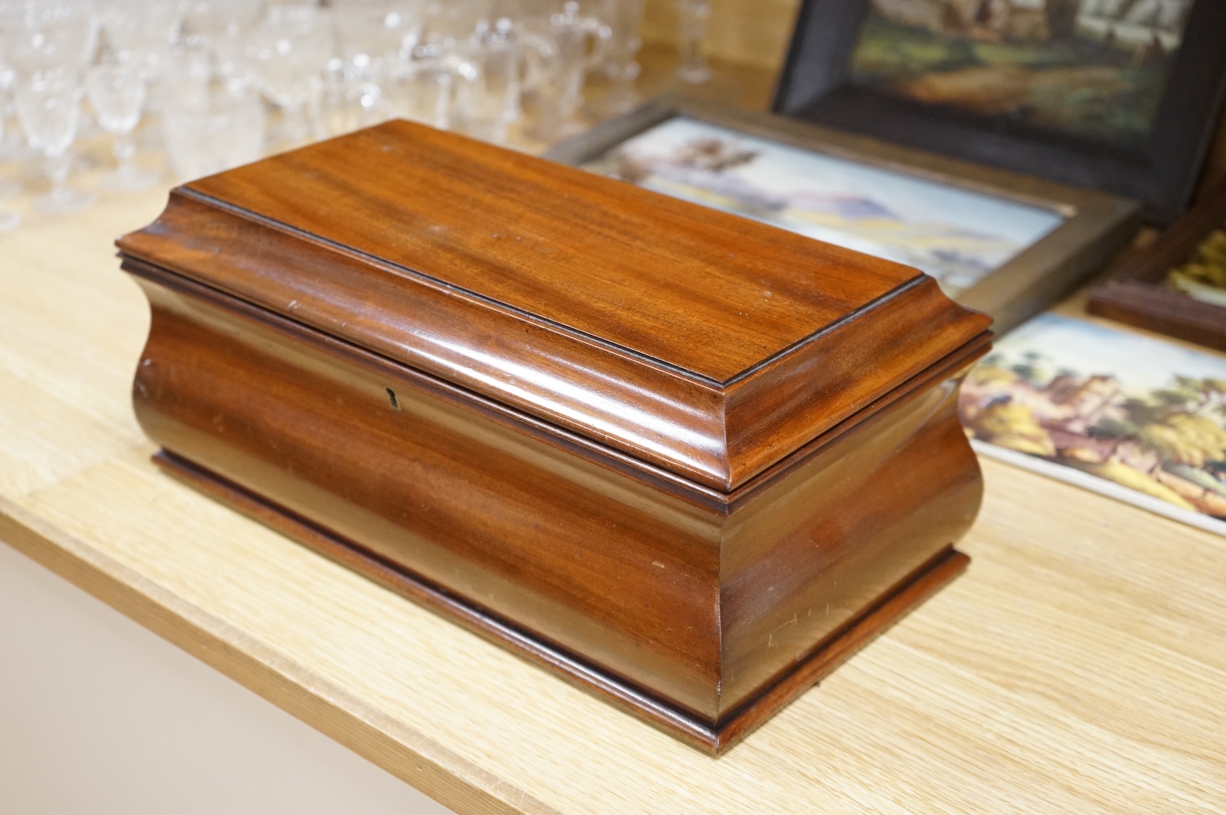 A 19th century mahogany sarcophagus tea caddy, with interior fittings, 35cm wide x 15.5cm high